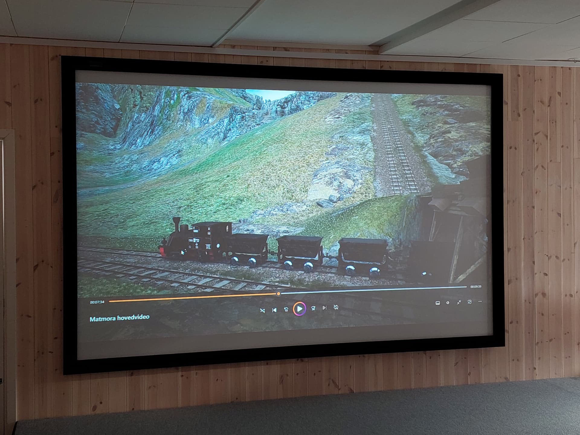 Cinematic screening of the Matmora reconstruction with an ore train on the mountain railway