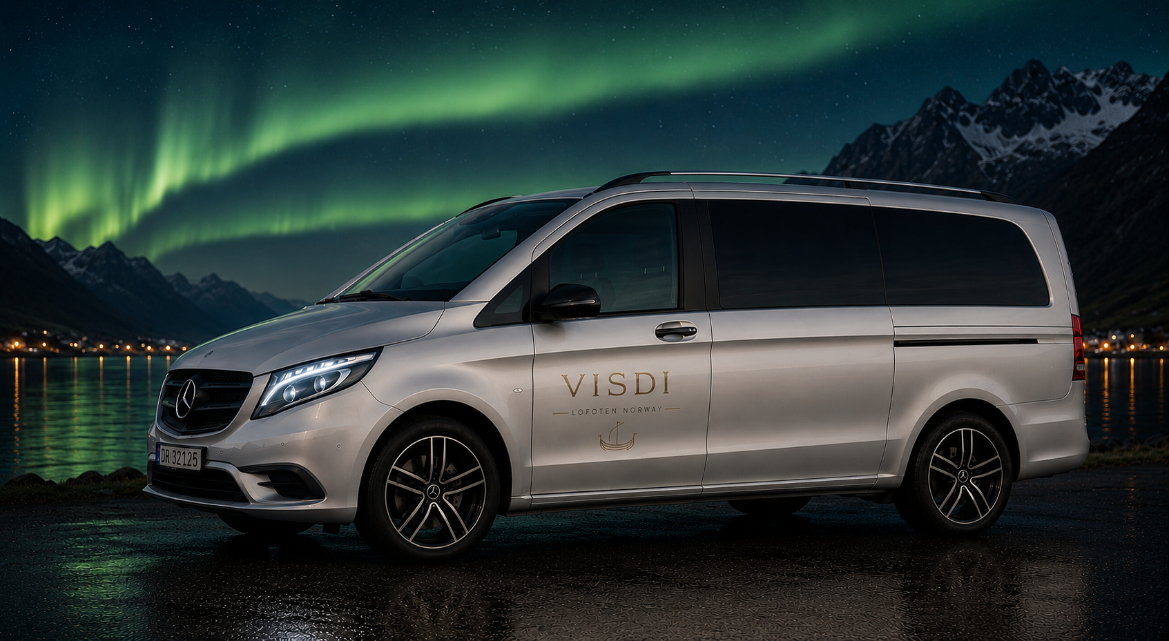 Silver Mercedes Vito with gold VISDI logo parked by the fjord under a green aurora arc